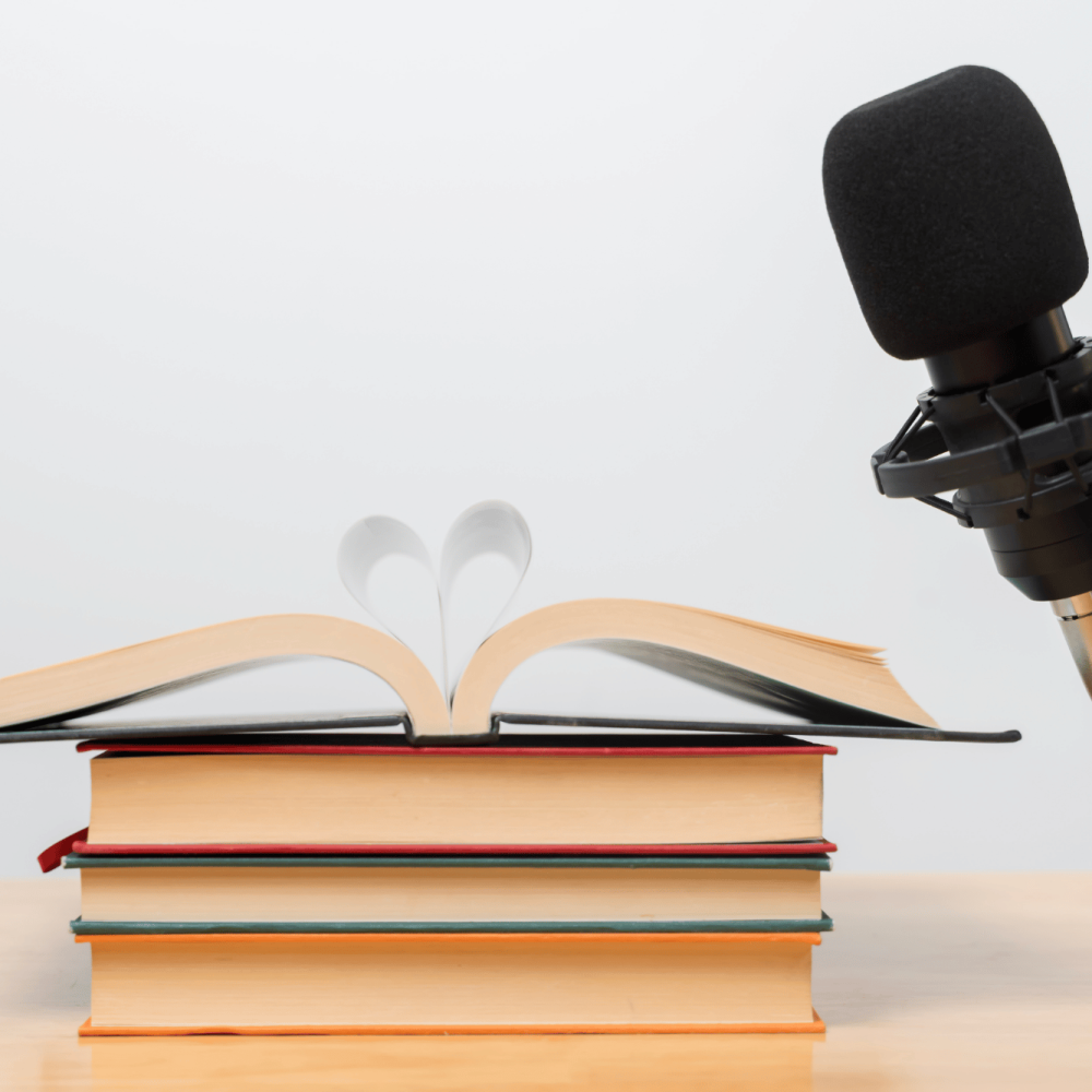 Audiobook narration concept with open book pages forming a heart